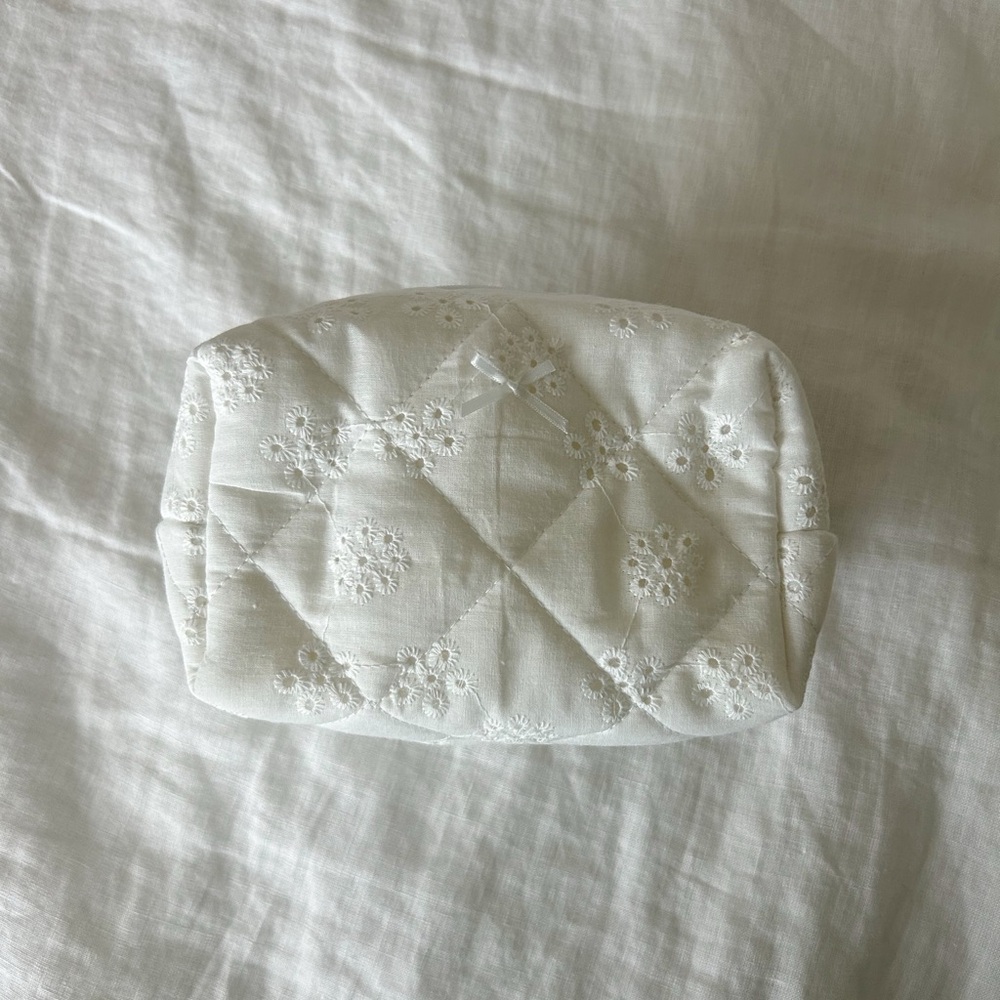 White eyelet quilted make up bag